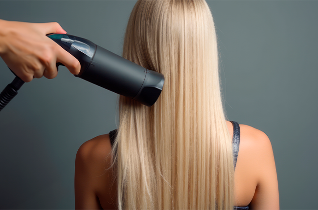 hairdresser-blowdrying-blonde-womans-hair