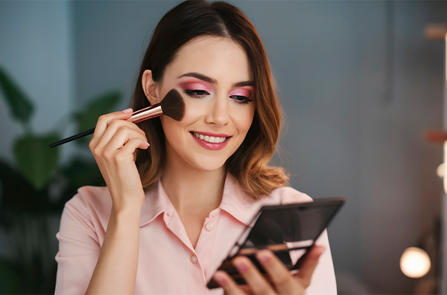 professional-woman-beauty-blogger-streams-video-about-makeup-applies-colorful-shadow-with-cosmetic